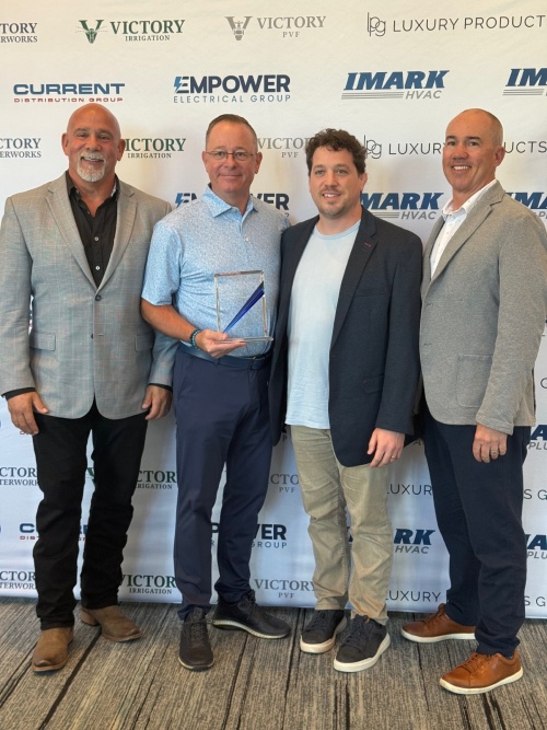 Merit Brass representatives at the IMARK Plumbing Spring Meeting, where the company was recognized as 2026 Supplier of the Year.